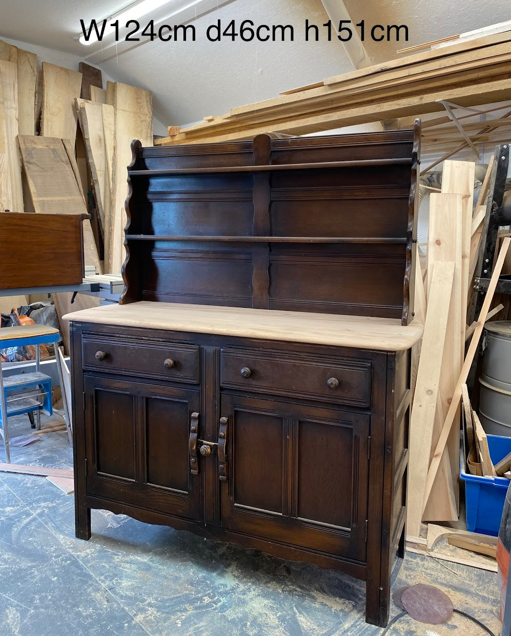 The dresser is shown here in our workshop, with the top stripped of its dark finish to reveal the grain of the wood. We have then sealed it with oil to protect.